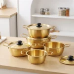Premium gold stainless steel cooking pot set with lids, Korean style ramen pots in various sizes for B2B wholesale and OEM.
