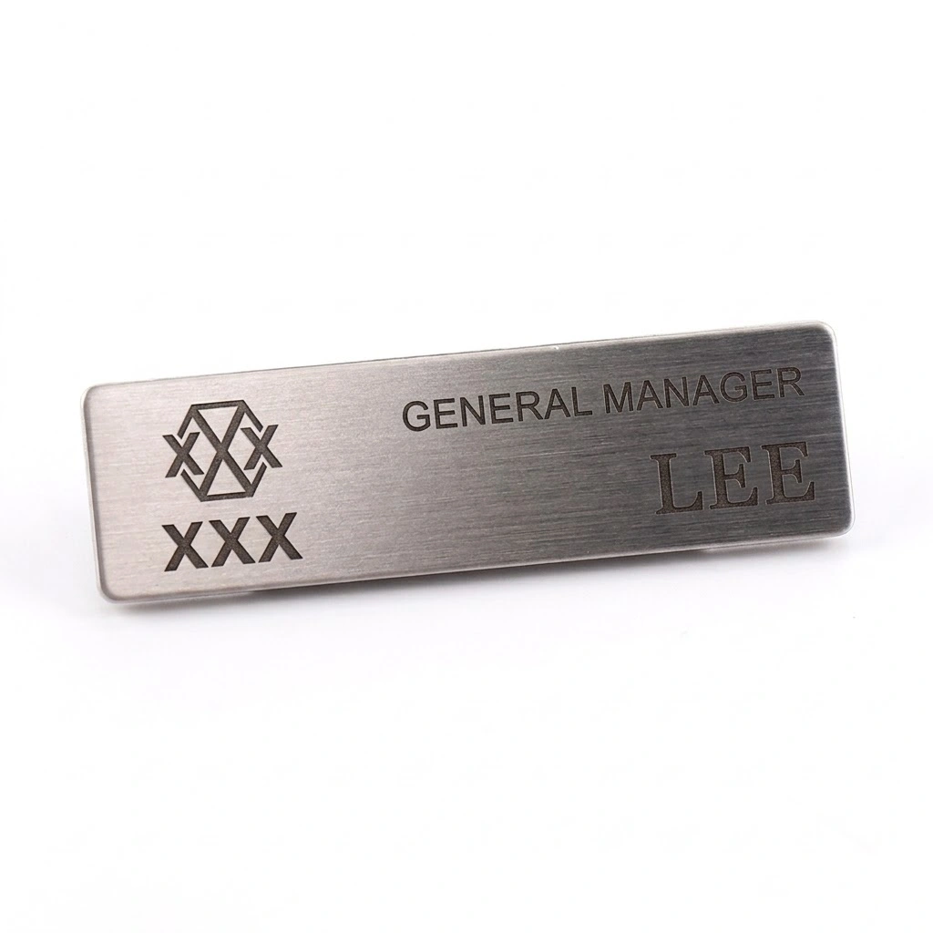OEM custom gold brushed metal staff name badges for corporate uniforms, available in bulk for wholesale buyers